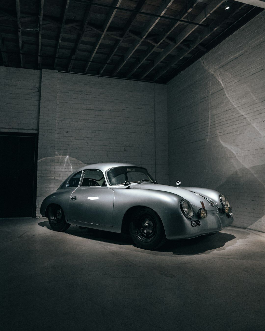 Elegant 1950s European classic automobile photographed in studio light