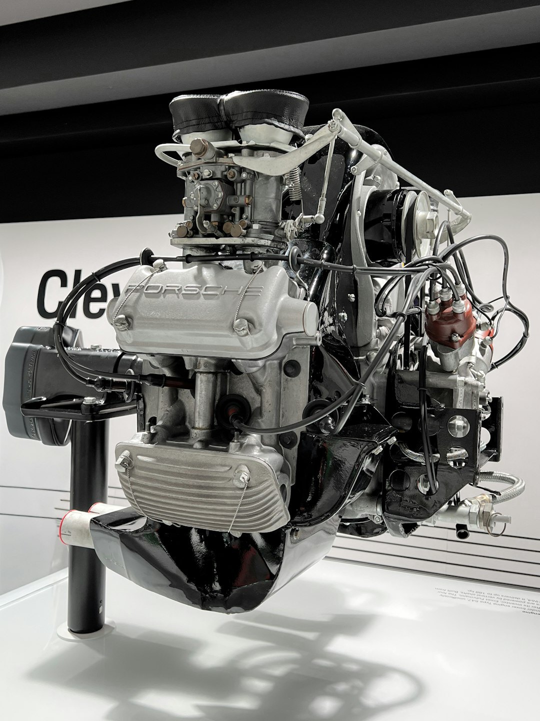 Polished vintage V12 engine displayed for a museum exhibition