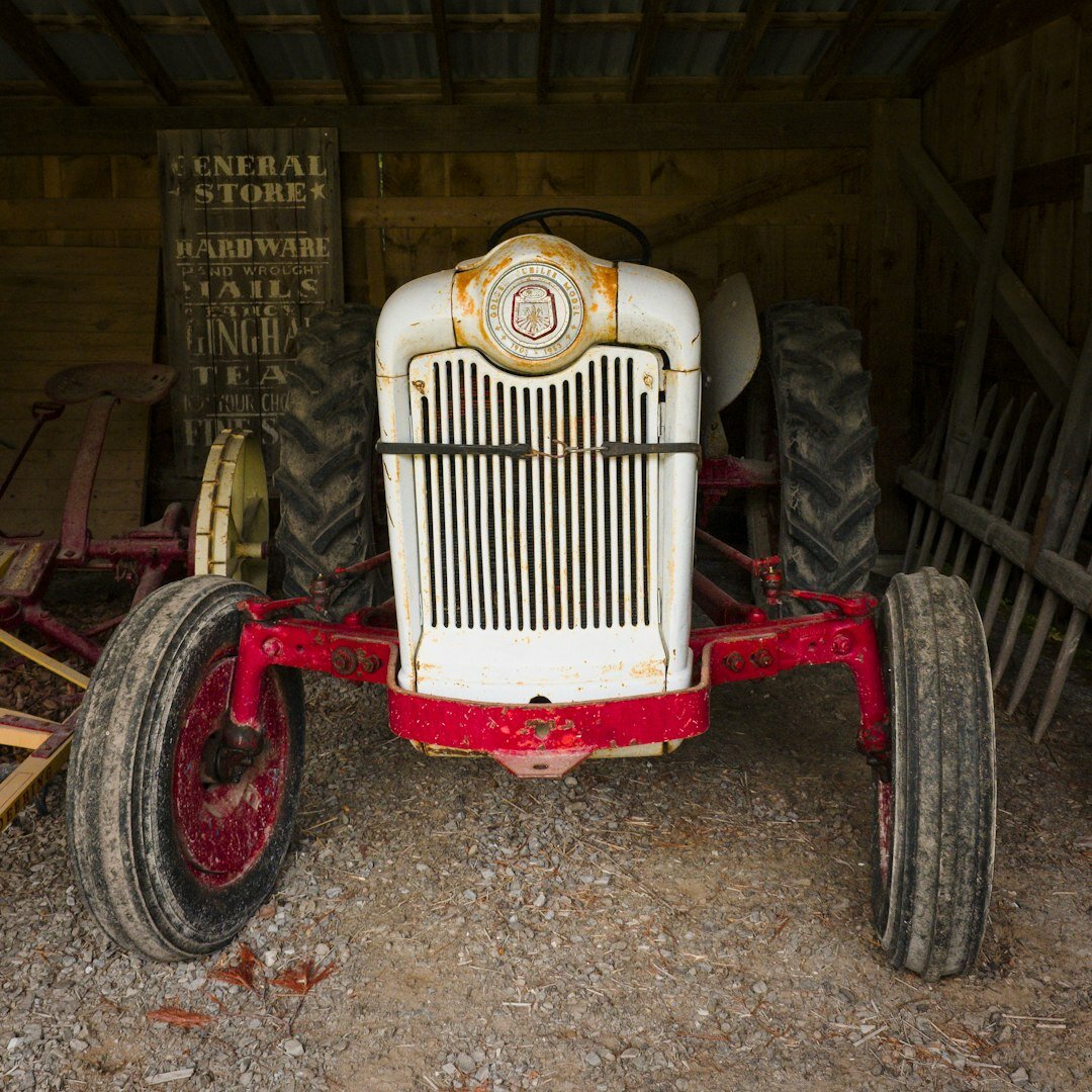 Weathered classic automobile stored in an old countryside barn